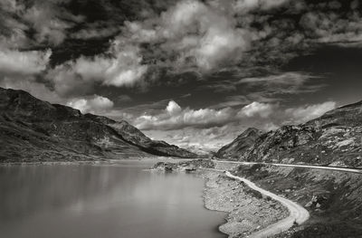 Scenic view of lake against cloudy sky