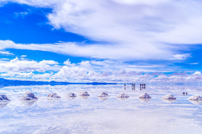 Scenic view of salt flat against sky