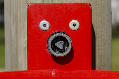 Close-up of red mailbox on wall