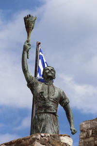 Low angle view of statue against sky