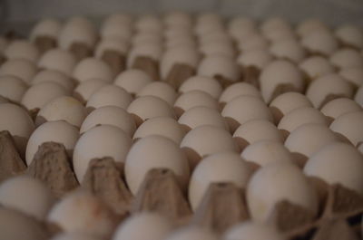 Close-up of eggs were lined on egg cartons