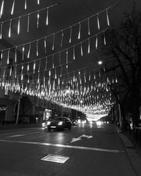 Cars on illuminated road at night