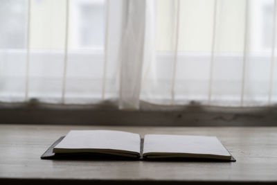 Close-up of open book on table