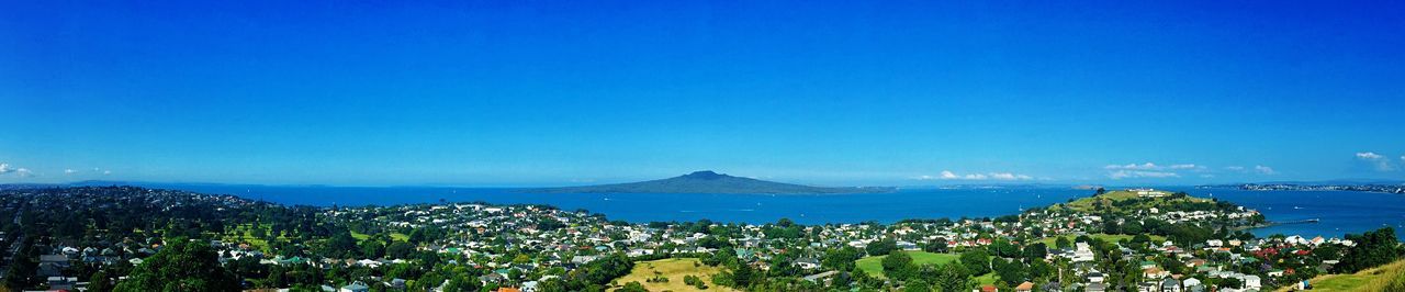 blue, sea, clear sky, scenics, beauty in nature, tranquil scene, copy space, water, tranquility, mountain, nature, high angle view, horizon over water, landscape, idyllic, sky, mountain range, coastline, outdoors, no people