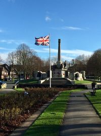 Scenic view of flag against sky