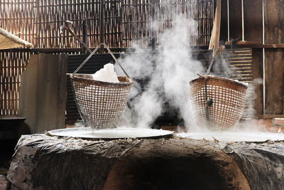 Selective salt in basket is hungover stove is product of salty water from underground in mountains.