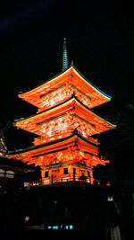 Low angle view of illuminated temple against sky at night