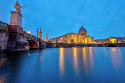 The rebuilt city palace and the television tower in berlin at dusk