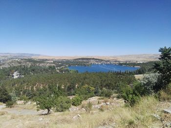 Scenic view of landscape against clear blue sky