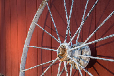 Close-up of wheel against wall