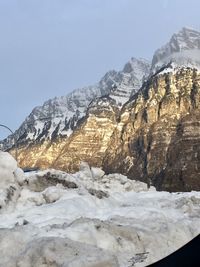 Scenic view of snowcapped mountains against clear sky