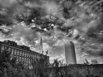 Low angle view of building against cloudy sky