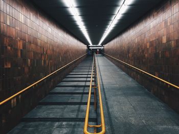 Illuminated tunnel at subway station