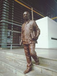 Statue against building