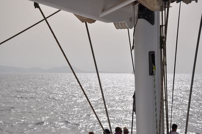 Sailboat sailing on sea against sky