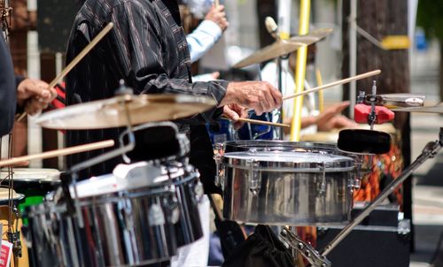 Close-up of man playing drums