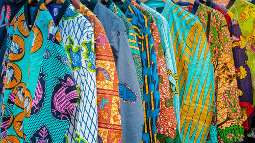 Full frame shot of multi colored umbrellas hanging at market stall