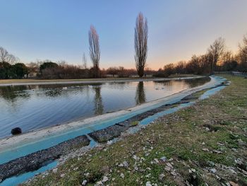 Scenic view of lake against sky during sunset