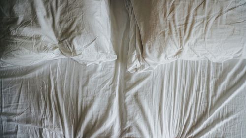 High angle view of pillows on bed