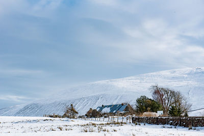 Scenic view of snowcapped mountain against sky