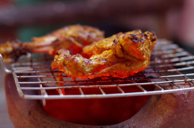 Close-up of meat on barbecue grill