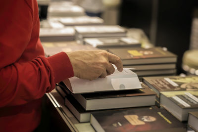 Close-up of hand holding book