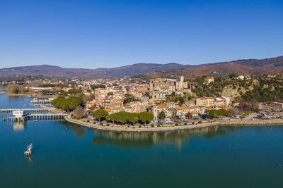 Aerial view of passignano sul trasimeno, a small town along the lake near perugia, 