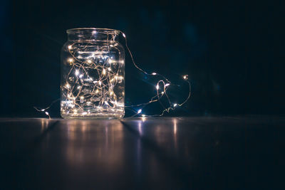 Close-up of glass jar on table