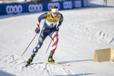 Midsection of person skiing on mountain during winter