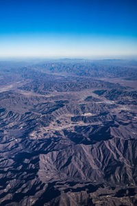 Aerial view of dramatic landscape against sky