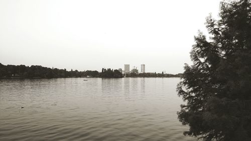 Scenic view of calm lake against clear sky