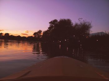 Scenic view of lake at sunset