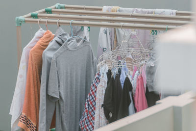Close-up of clothes hanging on rack in store