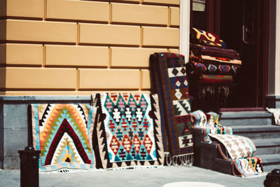 Multi colored chairs on table against wall in building