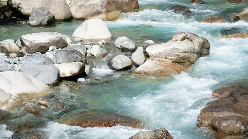 High angle view of rocks in sea