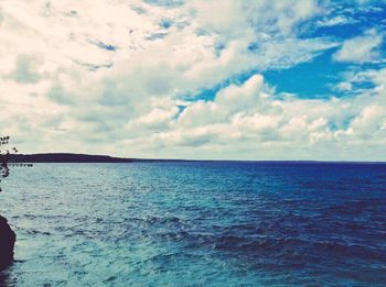 Scenic view of sea against cloudy sky