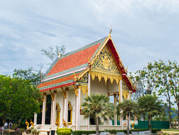 View of temple building against cloudy sky