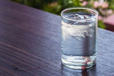 Close-up of glass of water on table