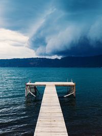 Pier on sea against sky