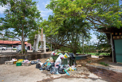 Rear view of people walking by built structure