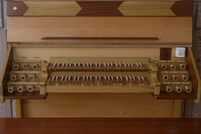 High angle view of piano keys on table