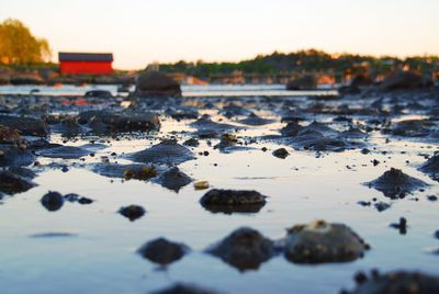 Close-up of water against sky during sunset