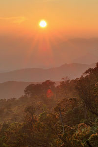 Scenic view of mountains against sky during sunset