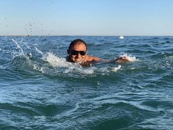 Portrait of man swimming in sea 