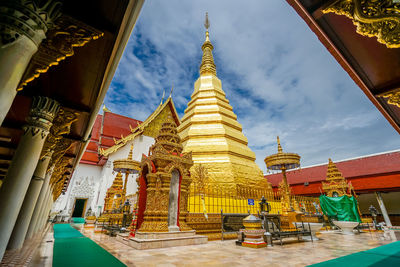 Low angle view of pagoda against buildings