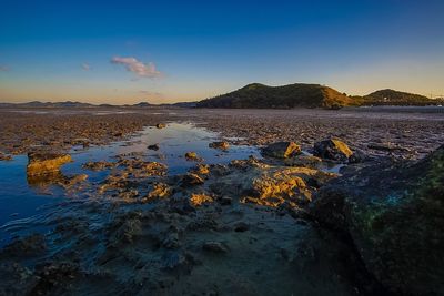 Scenic view of sea against sky at sunset