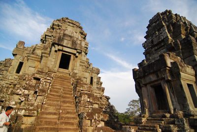 Low angle view of old ruins against sky