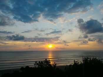 Scenic view of calm sea at sunset
