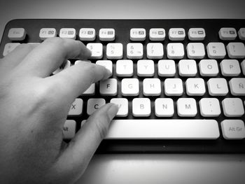 Close-up of hand using computer keyboard