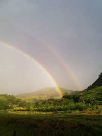 Scenic view of rainbow against sky